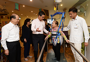 A resident does rehabilitation exercises under the guidance of a physiotherapist. Residents of the elderly home are full of praise for its services.